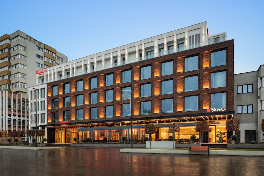 Parvixo hotel interior with natural stone, oak panels, and soft daylight