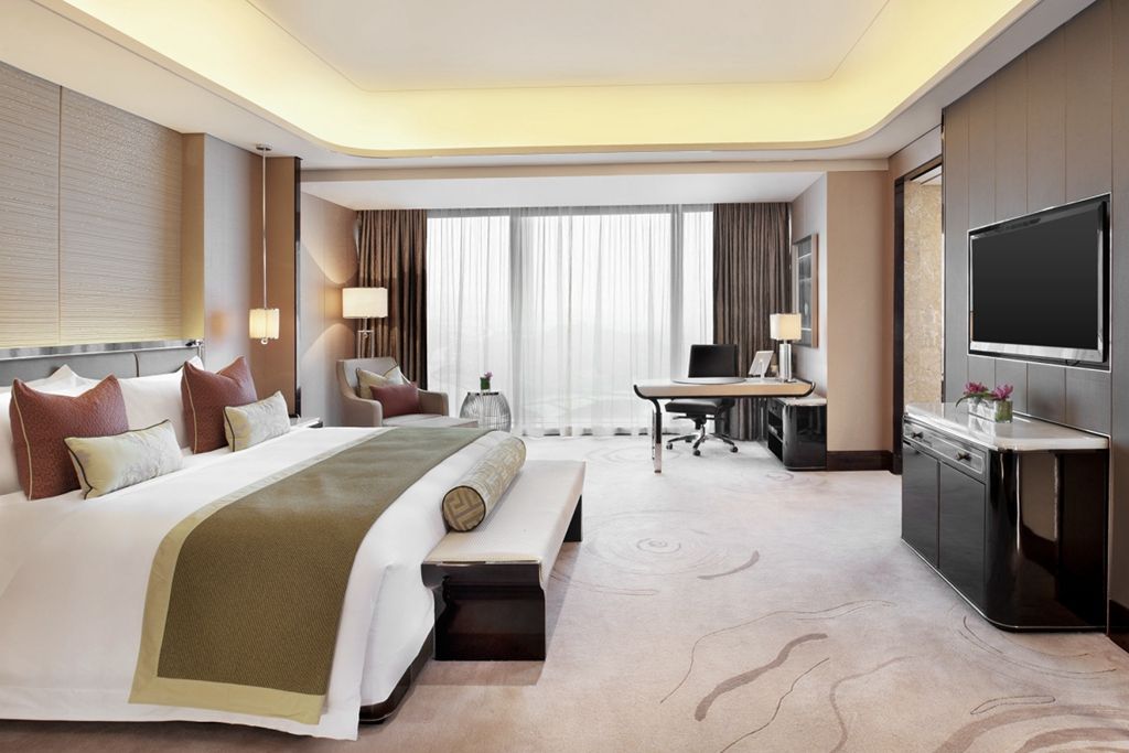 Parvixo guest room detail showing soft textiles and acoustic finishes